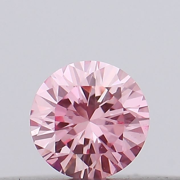 Actual 0.11 carat Vivid Pink Round lab-grown diamond