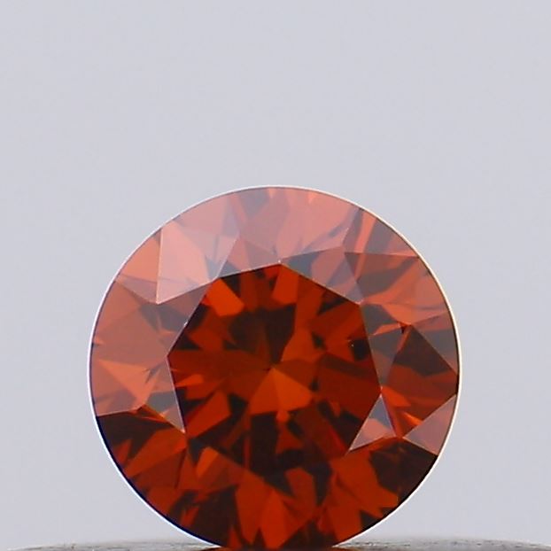 Actual 0.19 carat Vivid Orange Round lab-grown diamond