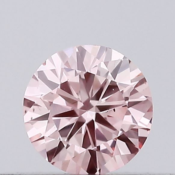 Actual 0.14 carat Intense Pink Round lab-grown diamond